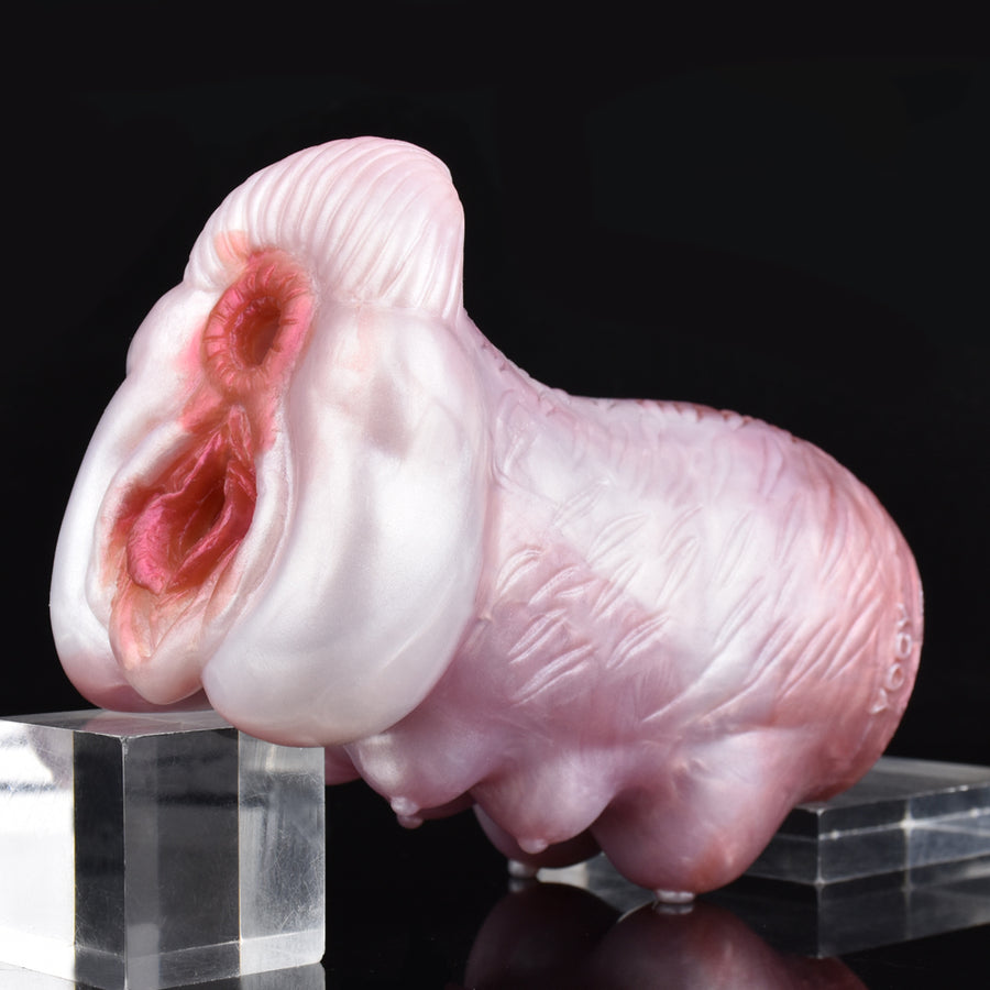 Pink canine-style stroker with two-hole face and ribbed body texture