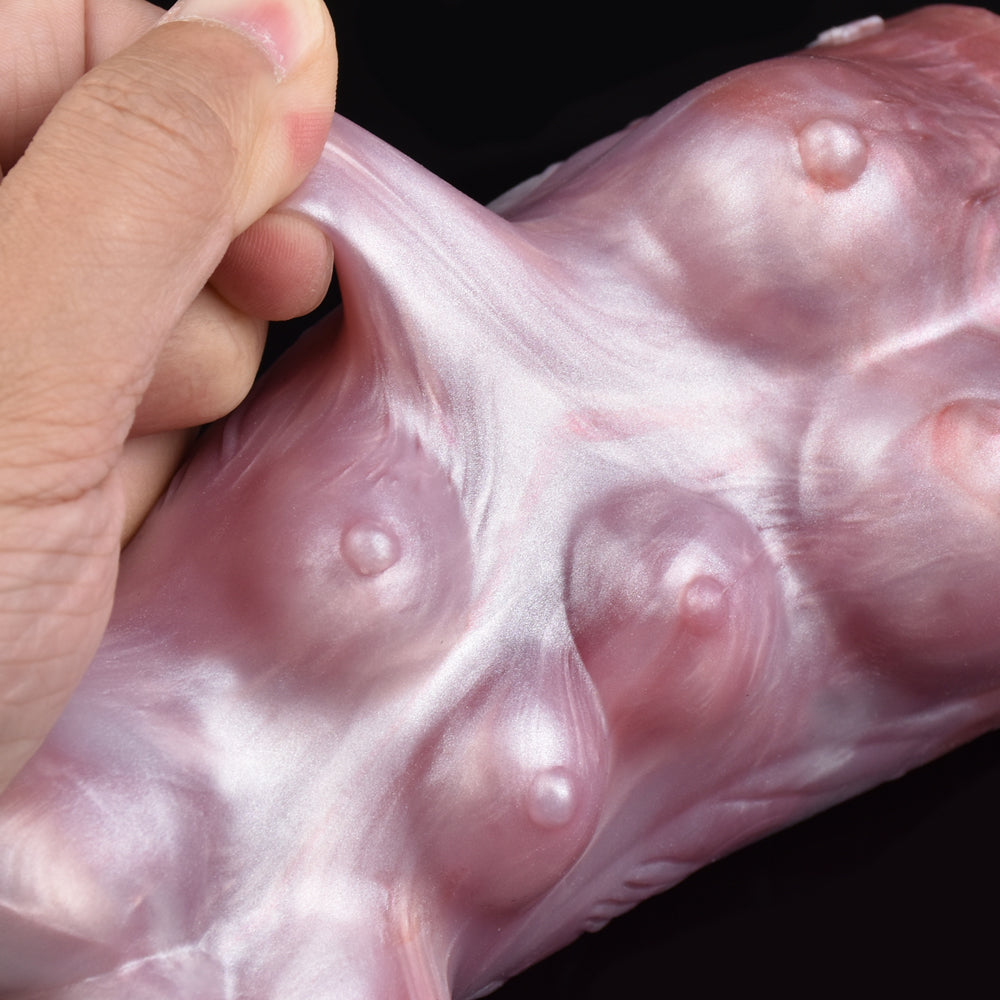 Light pink two-hole canine male stroker, textured ridges and small openings