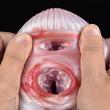 Front view of a pink two-hole canine stroker with ribbed top