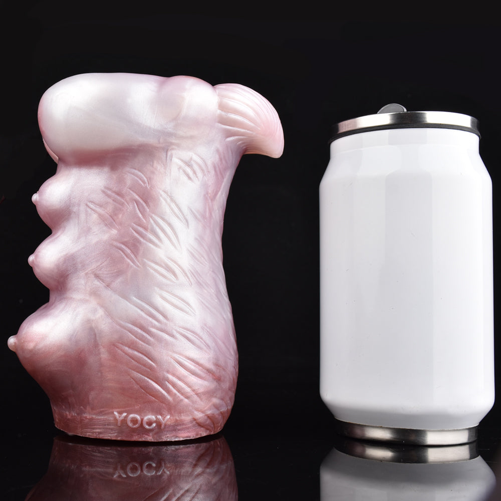 Pink silicone canine stroker with leaf-like texture on the body