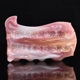 Pink canine stroker insert with molded inner channels and textured surface