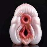 Close-up of two circular openings on a pink canine stroker
