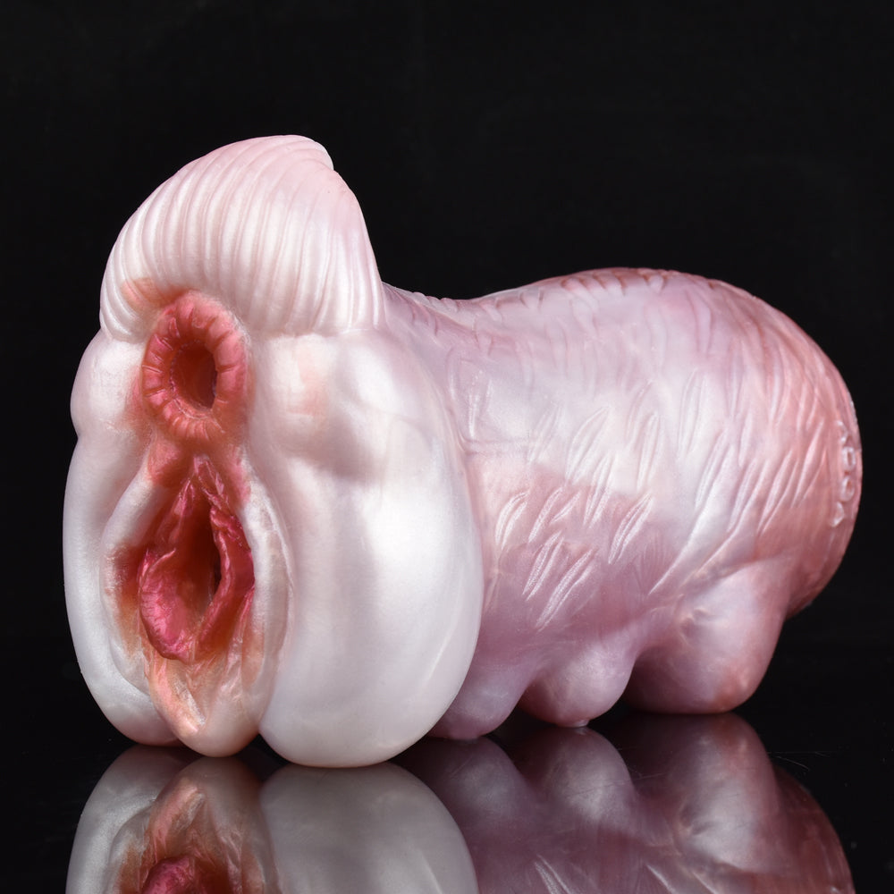 Two-hole canine stroker, pink silicone with ribbed base and curved body