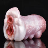 Two-hole canine stroker, pink silicone with ribbed base and curved body