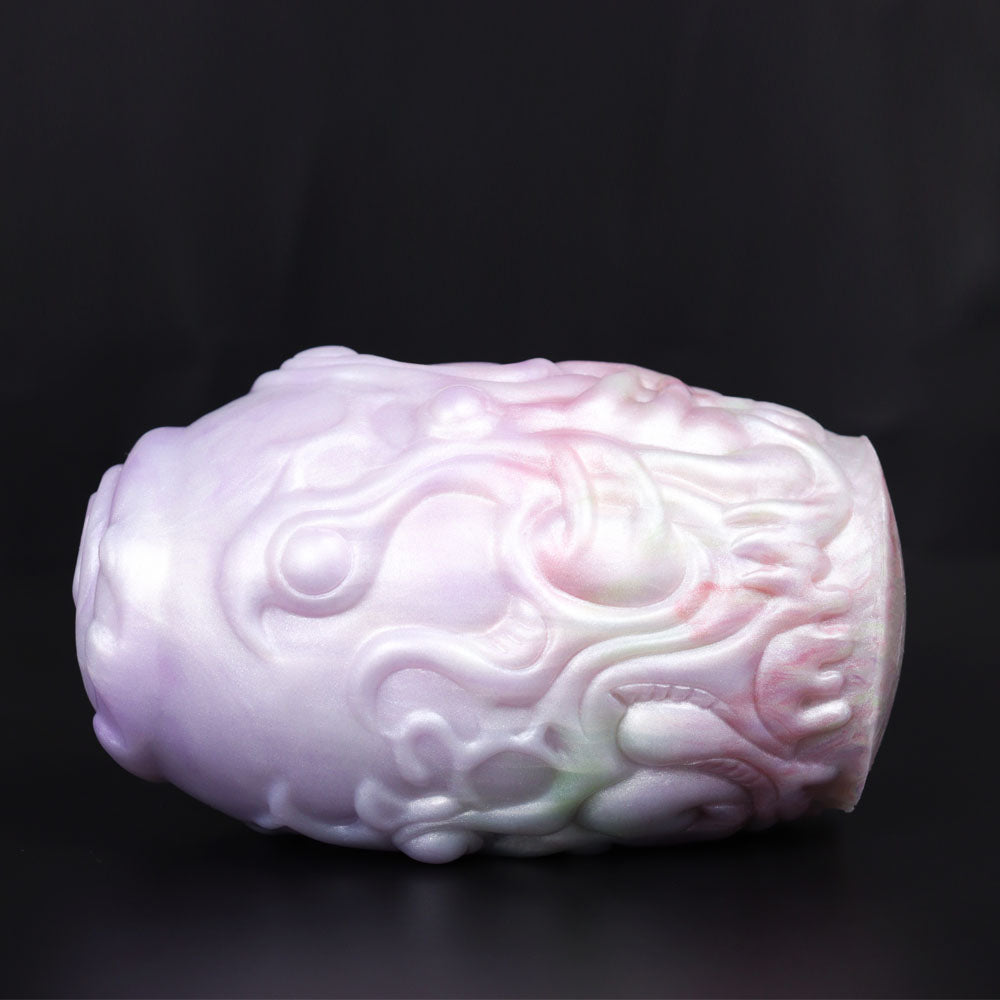 Dragon Egg male stroker, side view of pale textured body with raised swirls