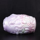 Dragon Egg male stroker, side view of pale textured body with raised swirls