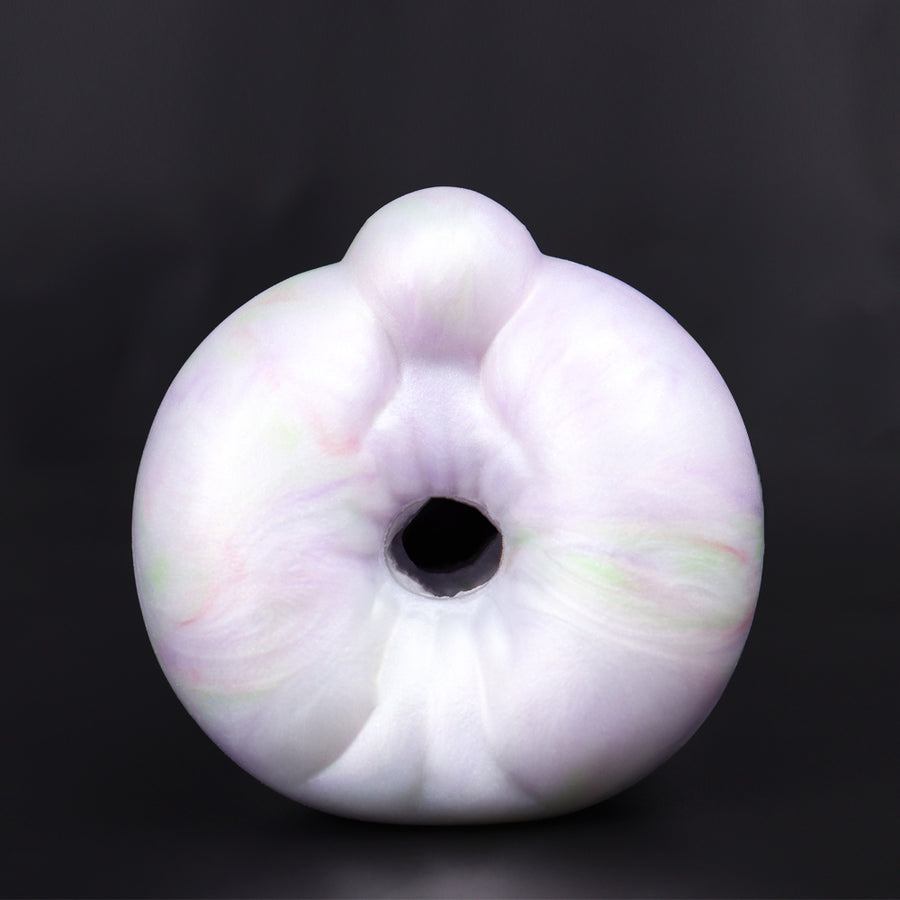 White ring male masturbator with hollow center opening, front view.