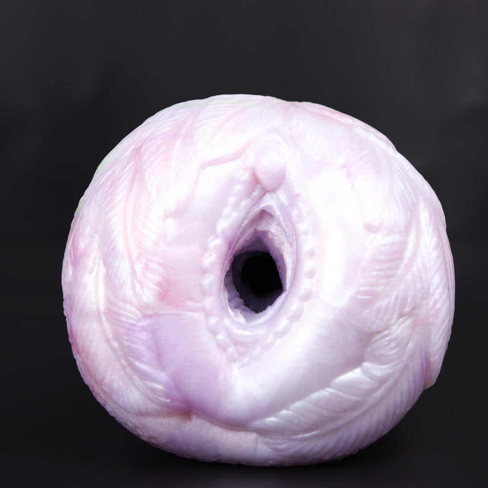Pink textured pocket cup masturbator with circular opening and inner ridges