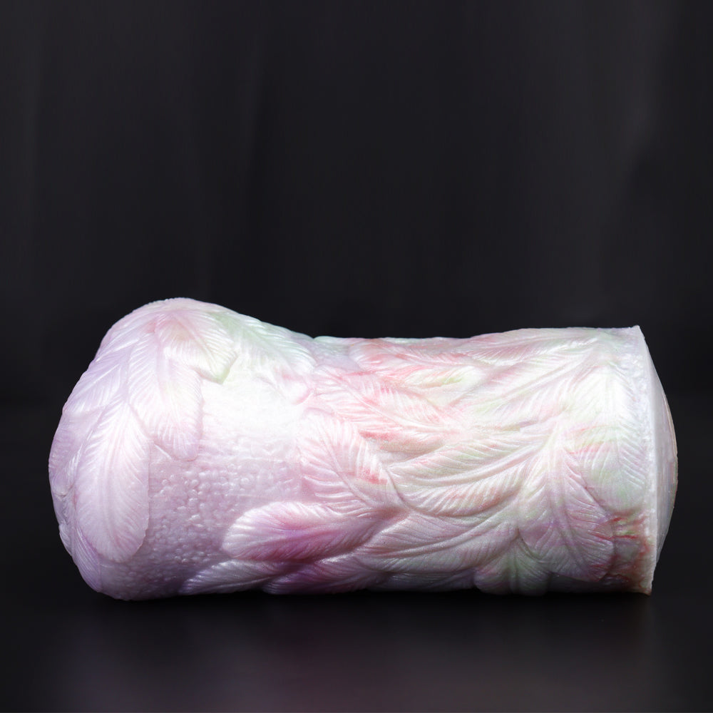 Pink textured pocket cup masturbator, curved shape and oval opening on one end