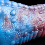 Close-up of blue-and-pink dragon male stroker texture with raised bumps and pores
