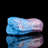 Blue-and-pink dragon male stroker, curved shape, scaly texture and two openings