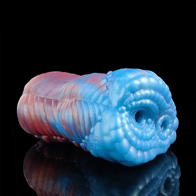 Blue-and-pink dragon male stroker with large rounded opening on the blue side