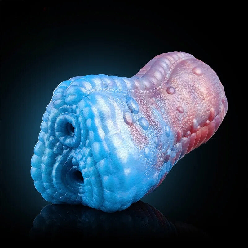 Dragon-shaped male masturbator with blue textured head and pink rounded tail section