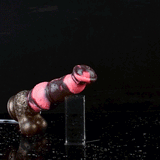 Horse-shaped dildo with knot, pink-and-dark glossy, side view of head end opening