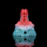 Ticus grinder toy with two circular openings on base, red-blue marbled finish