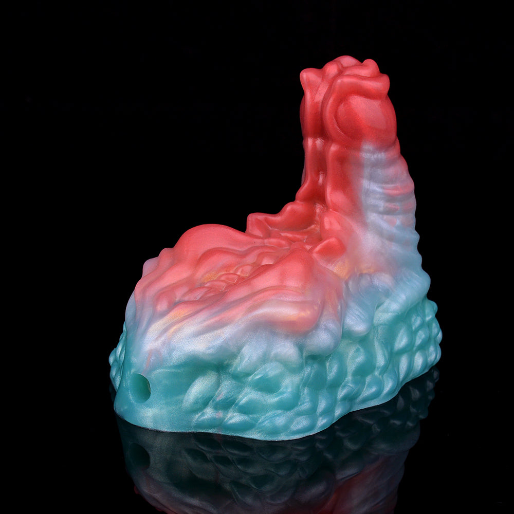 Ticus grinder toy, red top with translucent marbling over teal-blue textured body