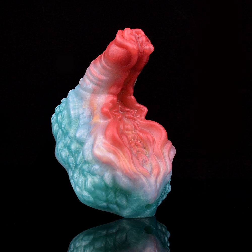 Ticus vibrating grinder toy, angled view with red top and blue marbled base