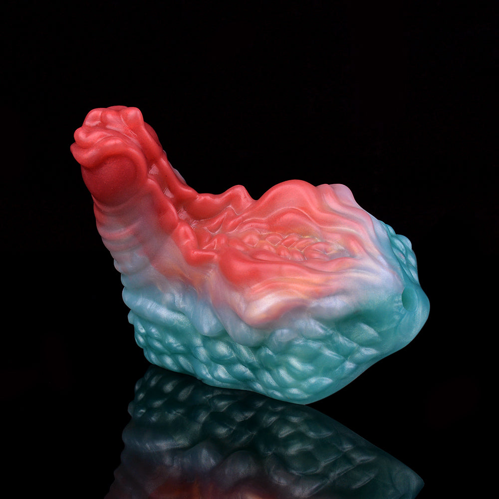 Ticus grinder toy in red-to-blue marbled silicone with raised textured ridges