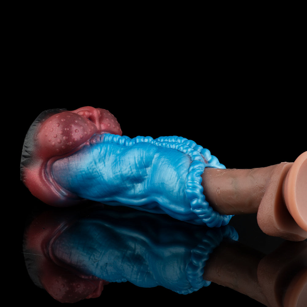 Blue ribbed shaft with red ball end and gray collar, resting on finger
