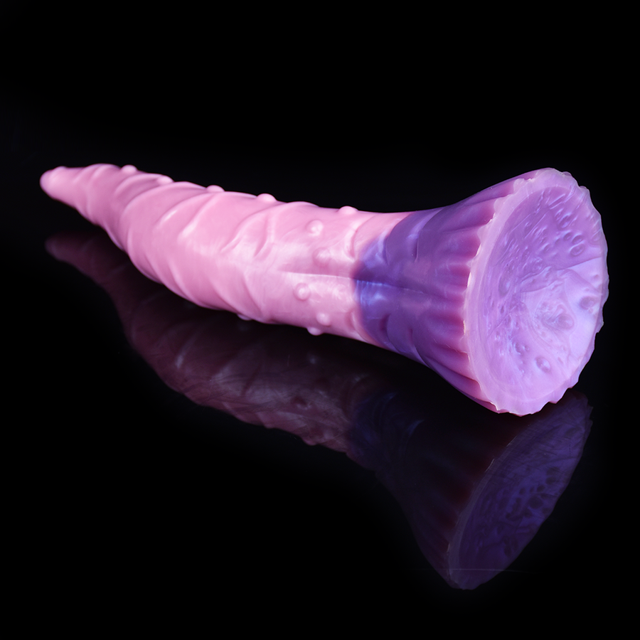 Large silicone tentacle dildo, pink body with purple fin-like base, glossy textured surface.