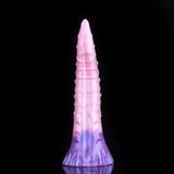 Standing view of pink-purple silicone octopus butt plug with ribbed tentacle