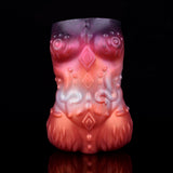 Twin Ember clutch front view, sculpted pattern on red and purple body
