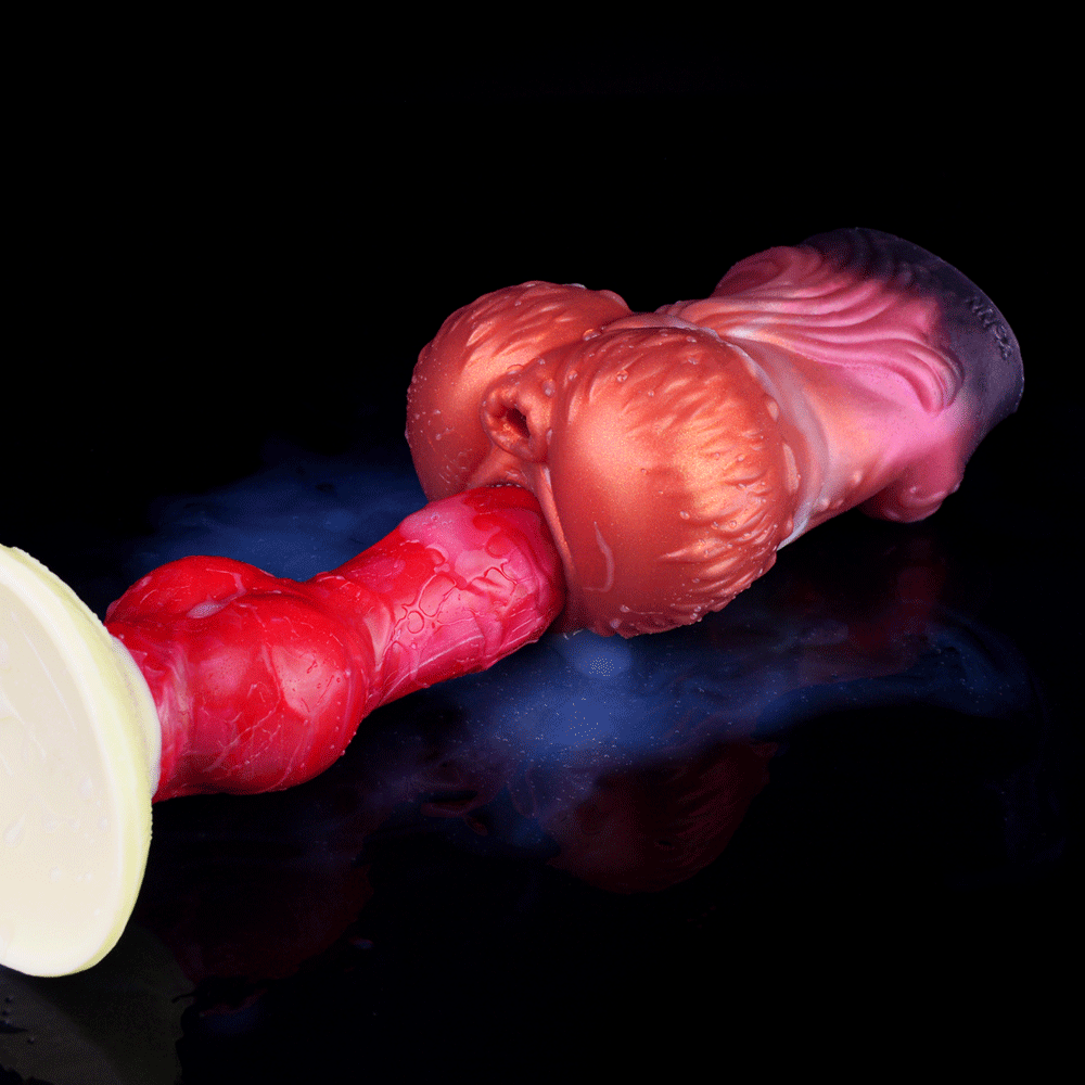 Twin Ember clutch, glossy red-and-purple toy form with flared tip