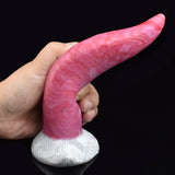 Hand holding pink textured silicone tongue vibrator with white flared base