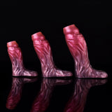 Three magenta-pink cock sleeve extenders with textured pattern, different lengths