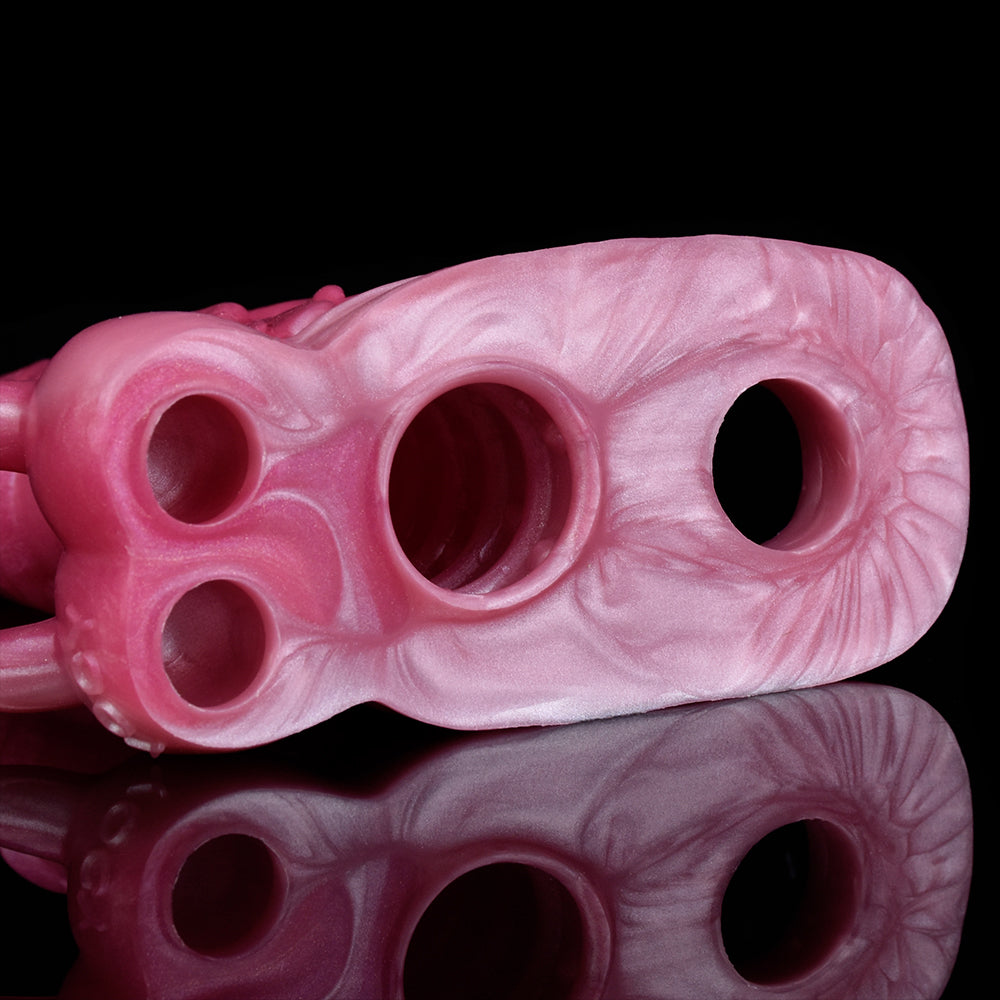 Pink monster dragon sleeve underside with three circular holes and textured ridges