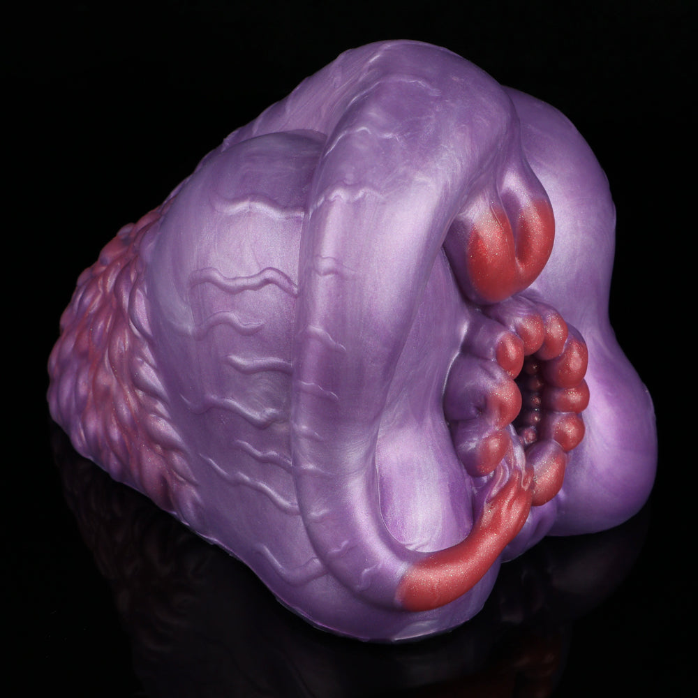 Purple silicone novelty toy with red curved top and inner bead cluster