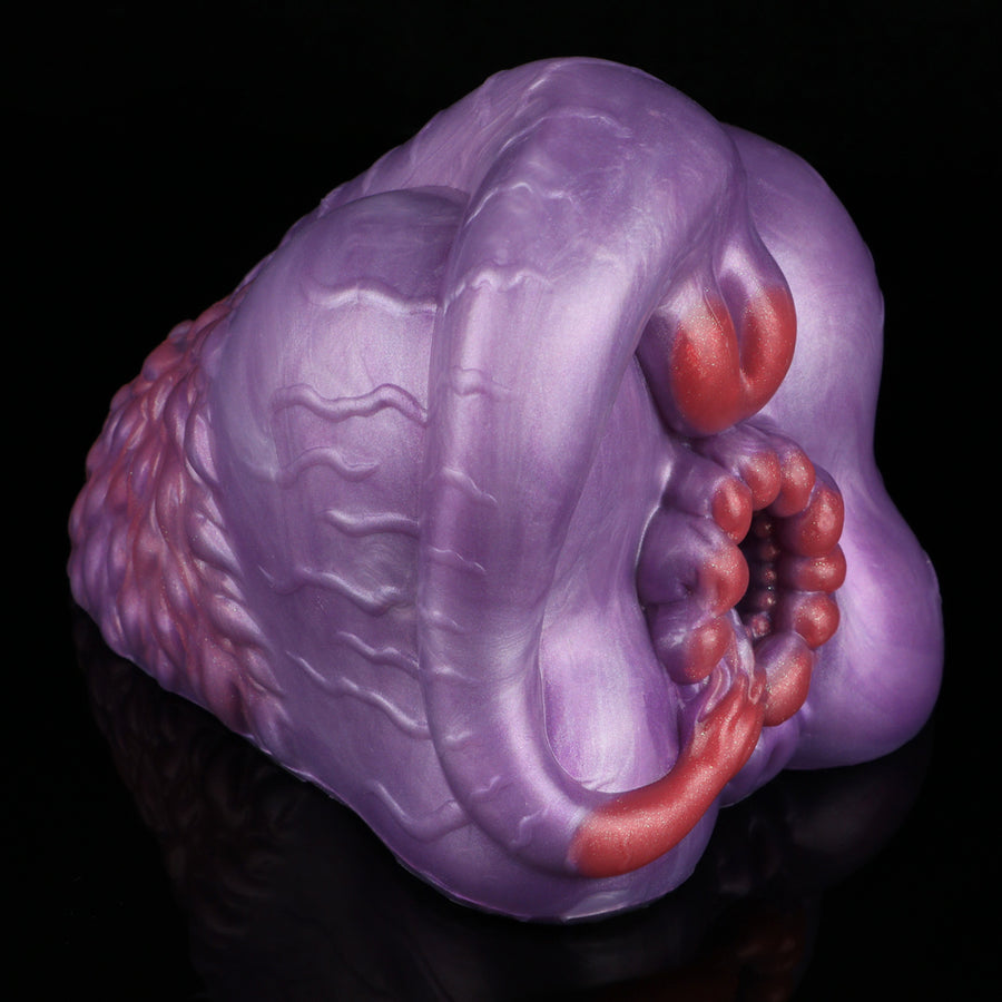 Purple silicone novelty toy with red curved top and inner bead cluster