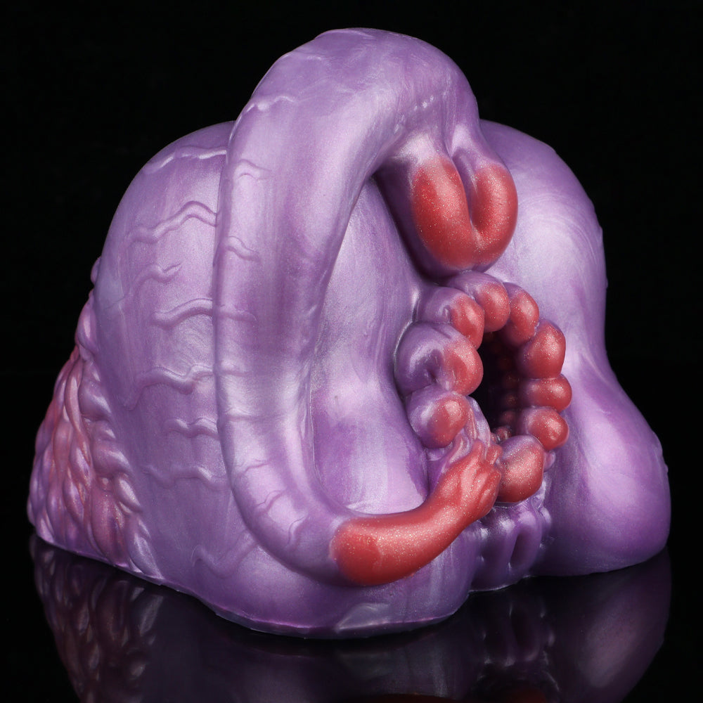 Purple silicone novelty toy with red inner beads and curved red detail