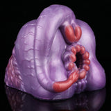 Purple silicone novelty toy with red inner beads and curved red detail