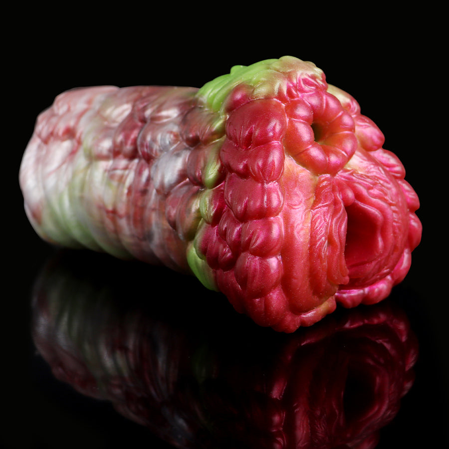 Fleshlight-style dragon masturbator, side view of pink and white textured openings