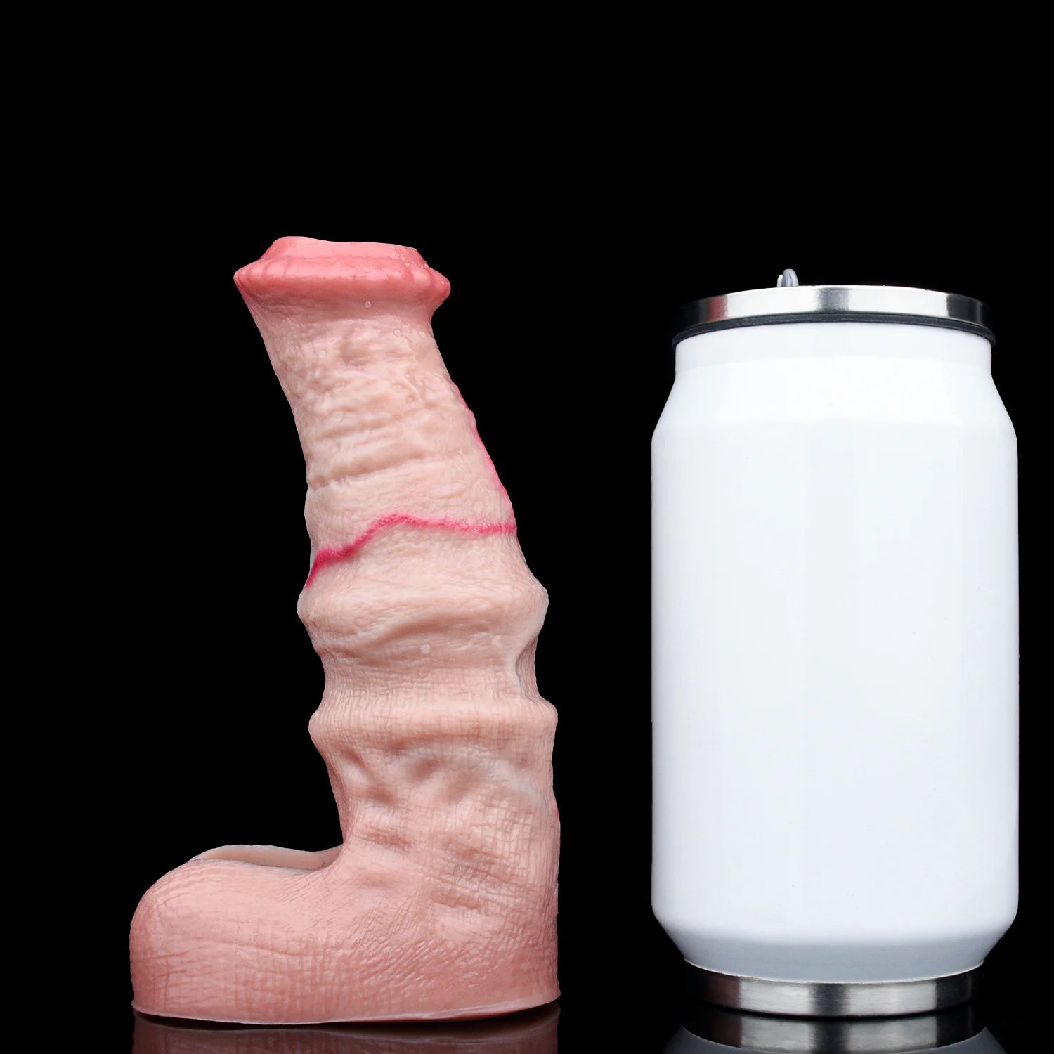 Pink textured cock sleeve/penis sheath displayed beside a white storage jar