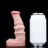 Pink textured cock sleeve/penis sheath displayed beside a white storage jar