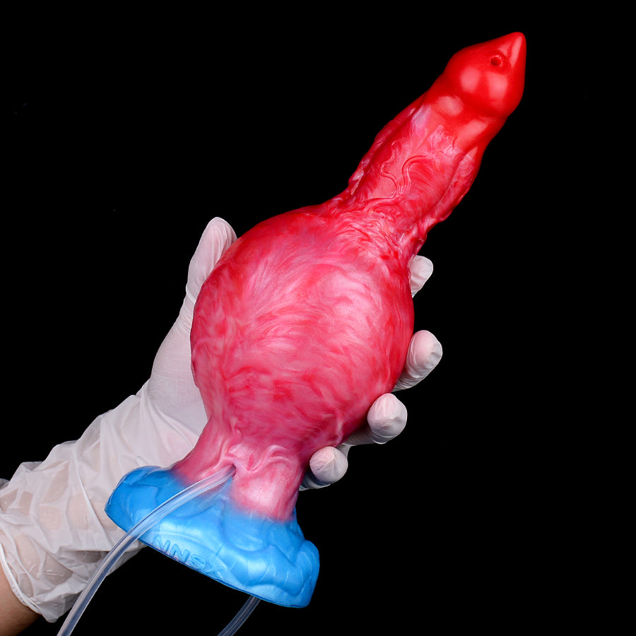 Inflatable dog-shaped toy in red and pink with blue base, shown in gloved hands