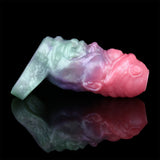 Alien sleeve extender, sideways view; mint sleeve and pink-purple alien head