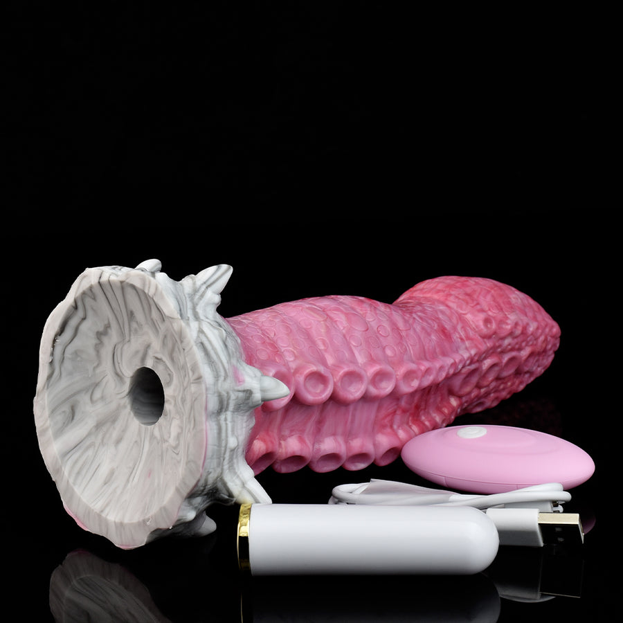 Monster tentacle vibrator with pink suction-textured head and white open-ring base