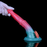 Dildo with demon horns, pink shaft angled diagonally with teal base and orange horns
