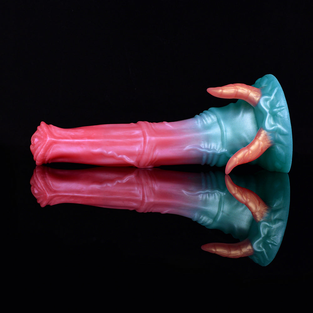 Dildo with demon horns, teal head with three orange horn tips and pink mirrored shaft