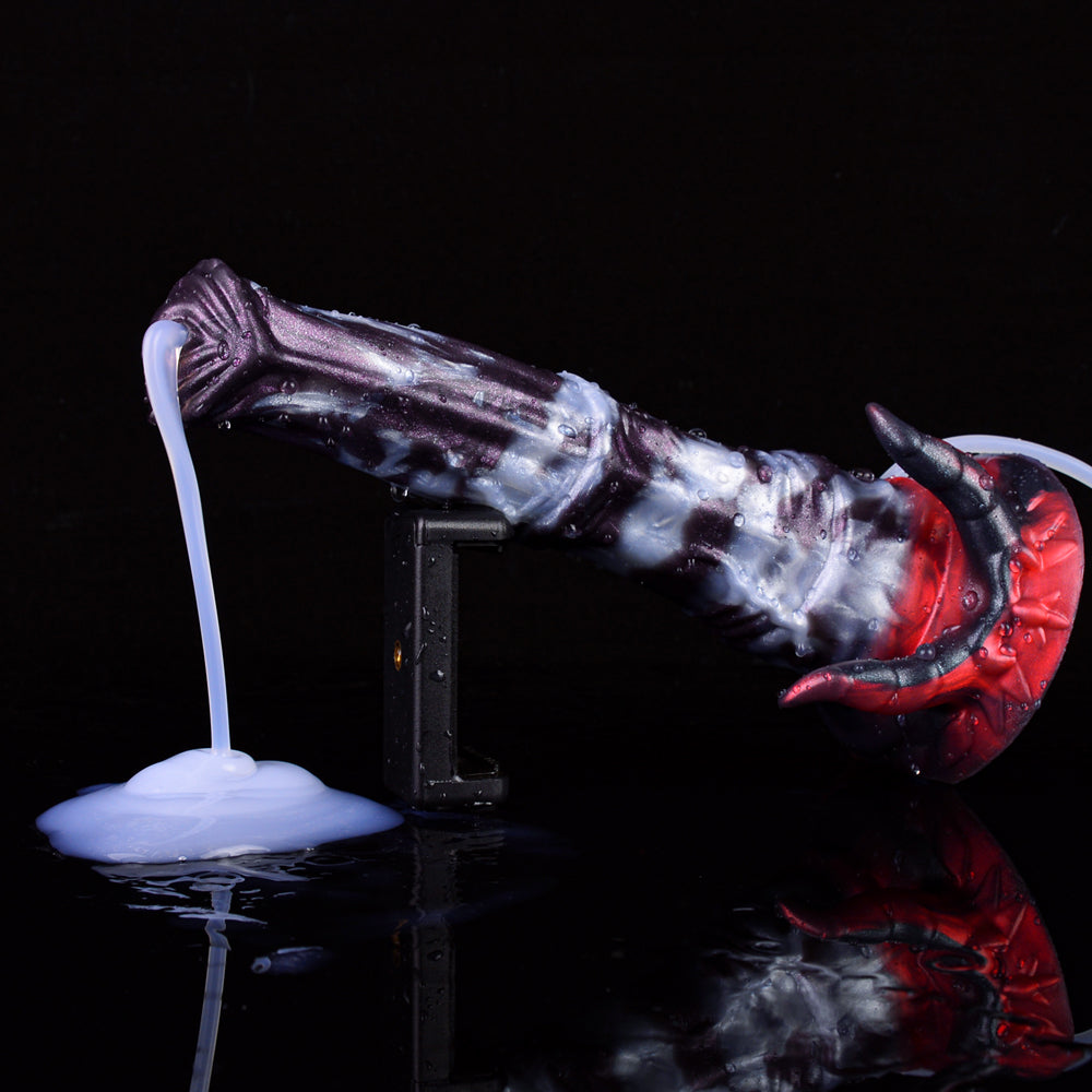 Fantasy beast squirting dildo: clear purple-blue with red spikes, base and tube