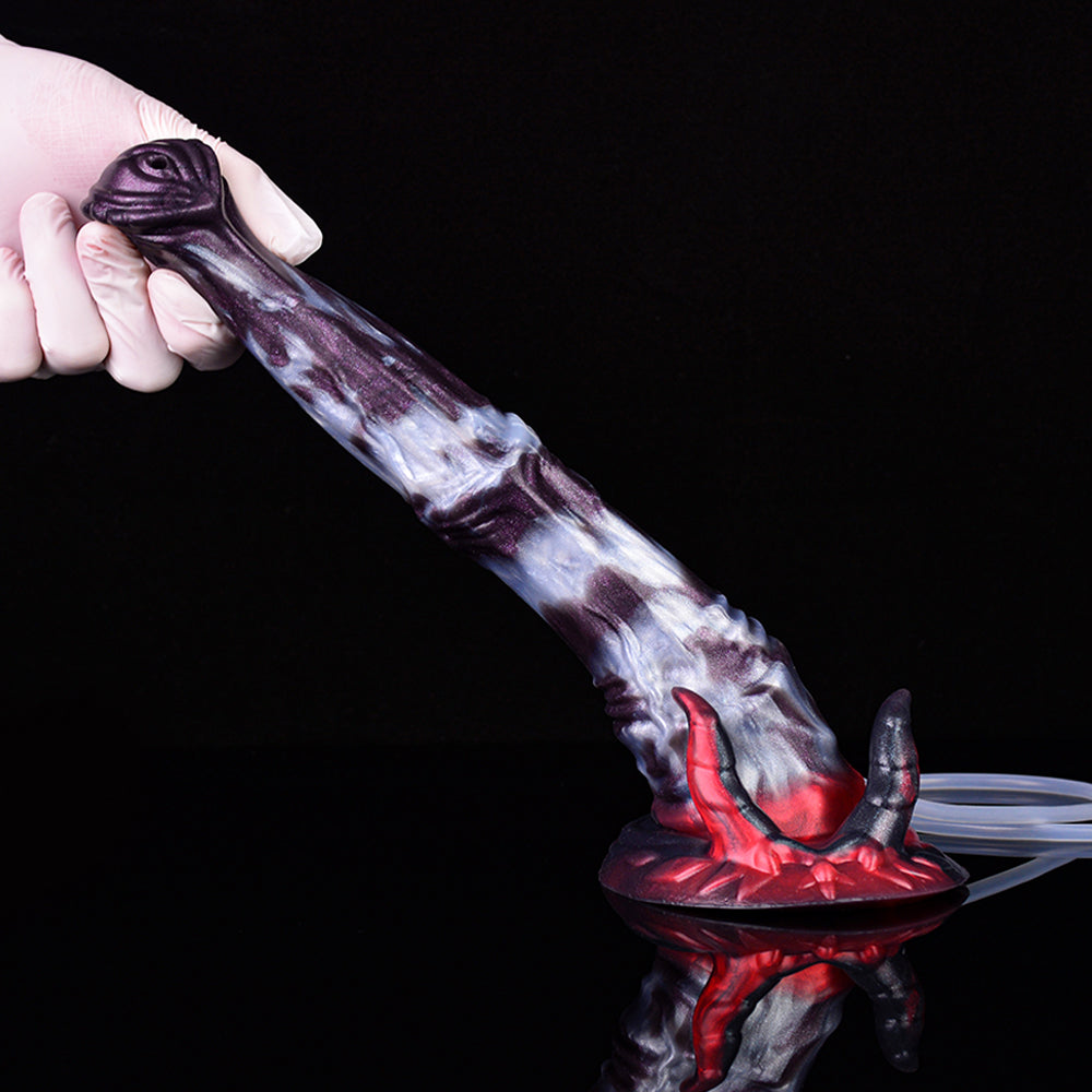 Handheld view of purple-gray fantasy squirting dildo with red horned base