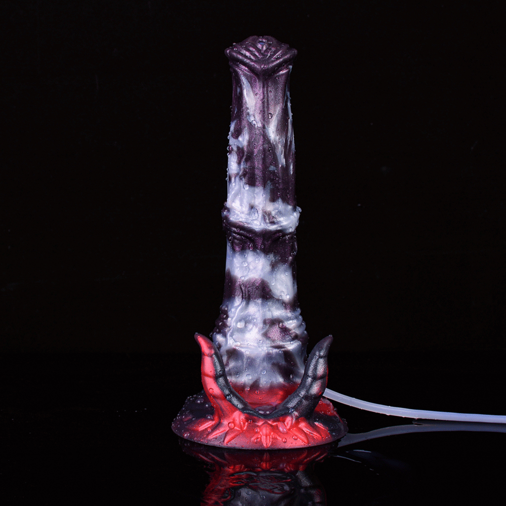 Front view of fantasy beast squirting dildo, purple-gray body with red horn base
