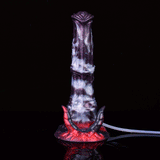 Front view of fantasy beast squirting dildo, purple-gray body with red horn base