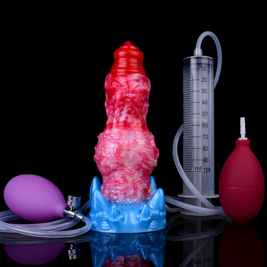 Inflatable dog-shaped toy with red-pink body and blue base, with syringe and pump
