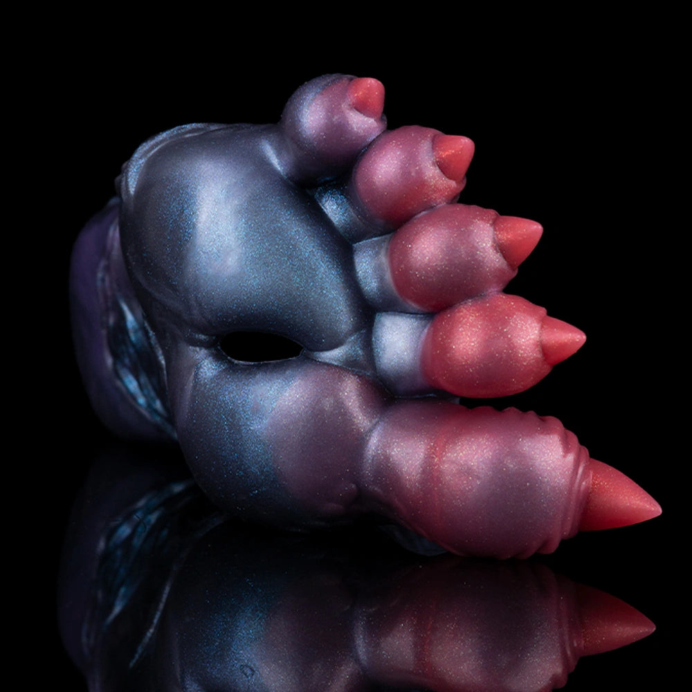 Blue dragon talon sex toy with red claw tips and curved hand-like shape, close-up