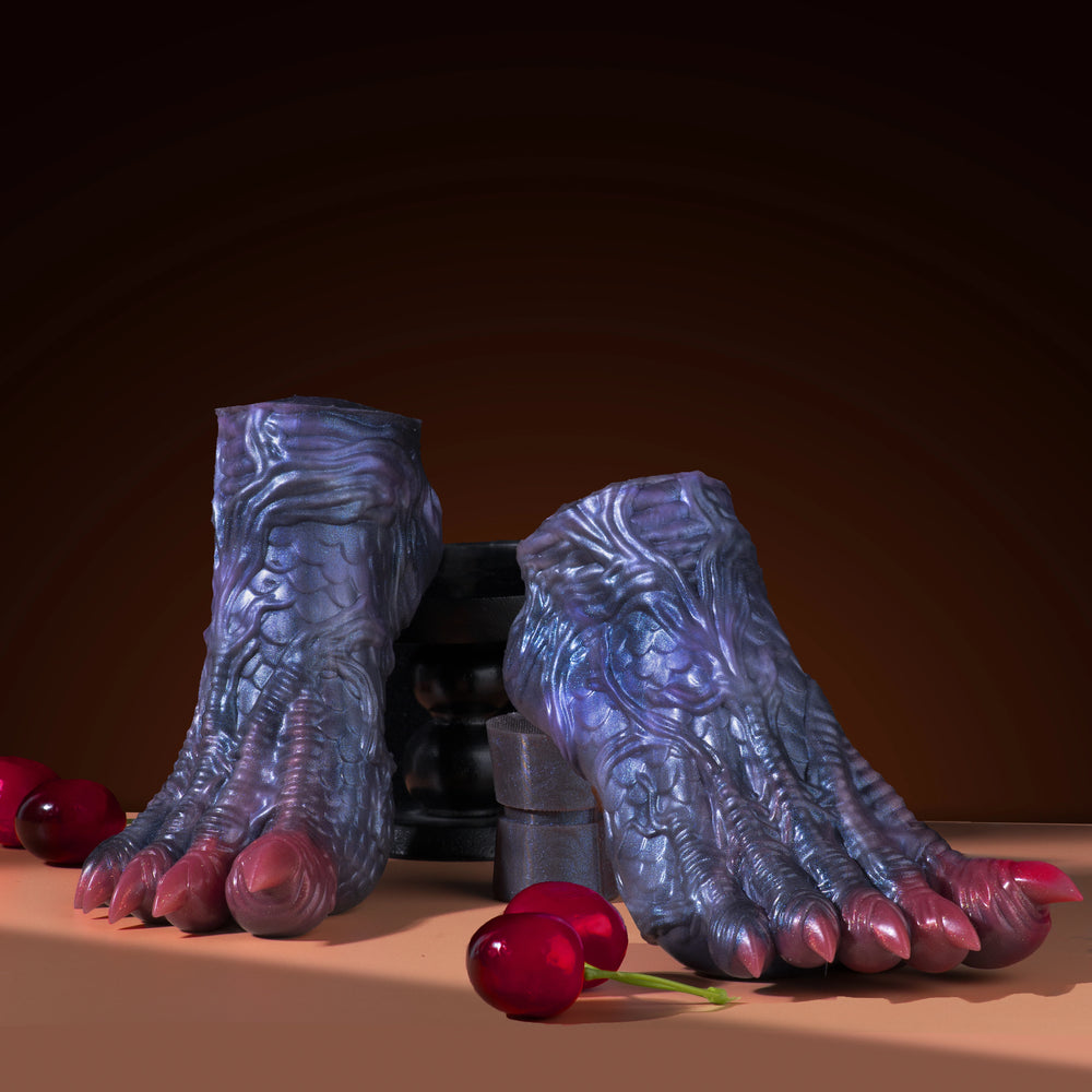 Blue dragon talon sex toy with red claw tips, top-down product view