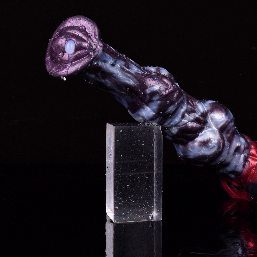 Purple-and-white patterned adult dildo with knot base, near clear splash shield
